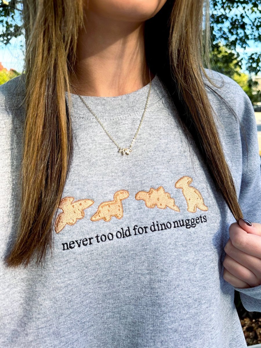 'Never Too Old For Dino Nuggets' Embroidered Crewneck Sweatshirt - United Monograms